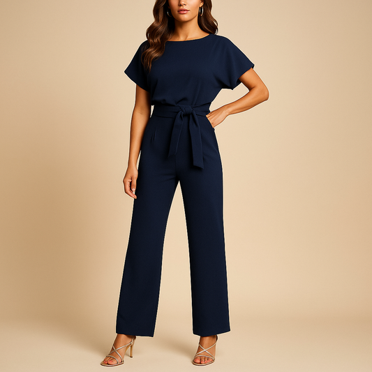 Women’s tailored jumpsuit with high waist and tie detail, available in black, navy, yellow, and apricot, ideal for work or casual chic styling.