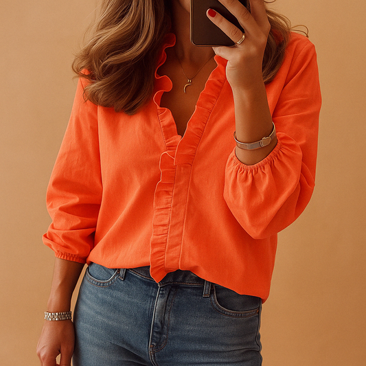 Women’s elegant blouse with subtle ruffles, designed for both casual and formal wear, featuring a flattering and timeless fit.