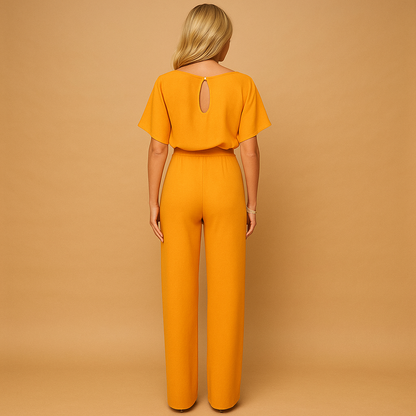 Women’s tailored jumpsuit with high waist and tie detail, available in black, navy, yellow, and apricot, ideal for work or casual chic styling.
